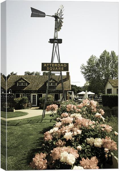 Windmill and a rose garden Canvas Print by Panas Wiwatpanachat