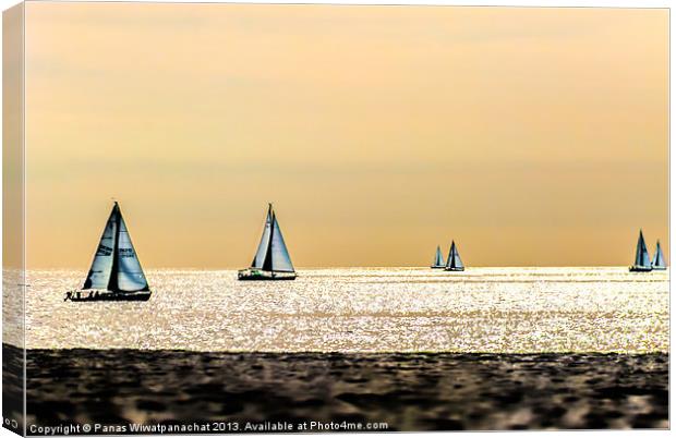 Sailboats and the Golden Sky Canvas Print by Panas Wiwatpanachat