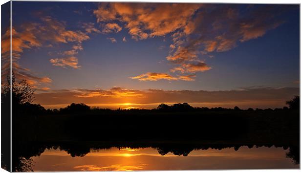 Sunrise over Lake Canvas Print by paul lewis
