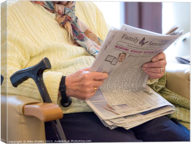 Reading the Newspaper Canvas Print by Mike Shields