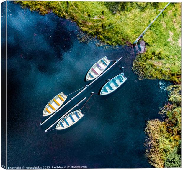 Four boats Canvas Print by Mike Shields