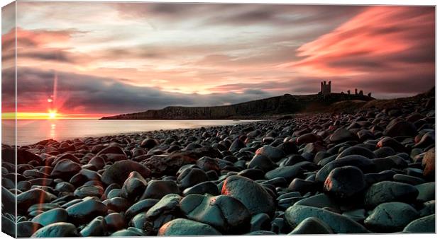 Dunstanburgh castle sunrise Canvas Print by James Marsden