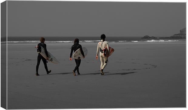 Surfers heading for the surf Canvas Print by Dan Fisher