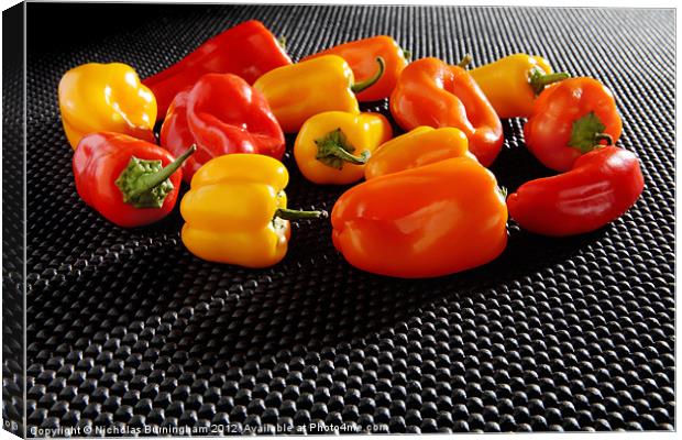 Red, Orange and Yellow Mini Bell Peppers Canvas Print by Nicholas Burningham