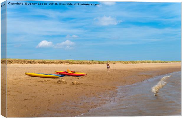 A stroll along the beach past some kayaks, canoes Canvas Print by Jonny Essex