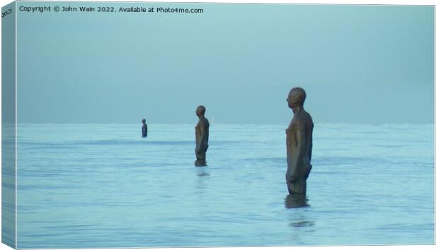 Three Men on the beach Canvas Print by John Wain