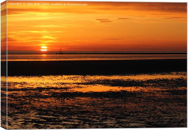 Dipping into the Sea Canvas Print by John Wain