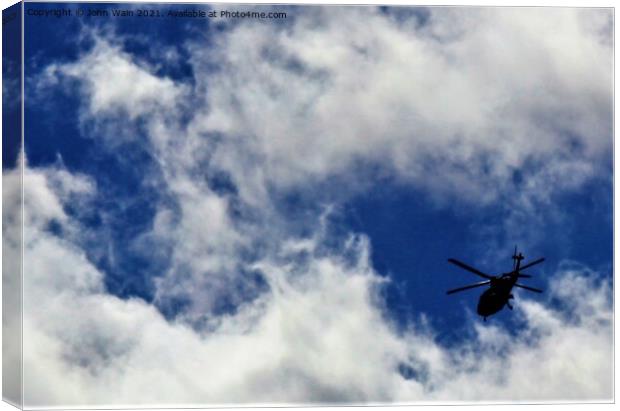 Private helicopter Canvas Print by John Wain