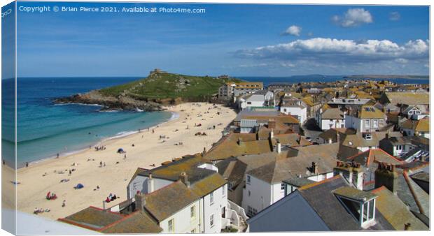 St Ives, Rooftops, Porthmeor Beach and the Island Canvas Print by Brian Pierce