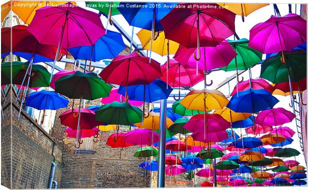 Umbrellas in Vinopolis Piazza Canvas Print by Graham Custance