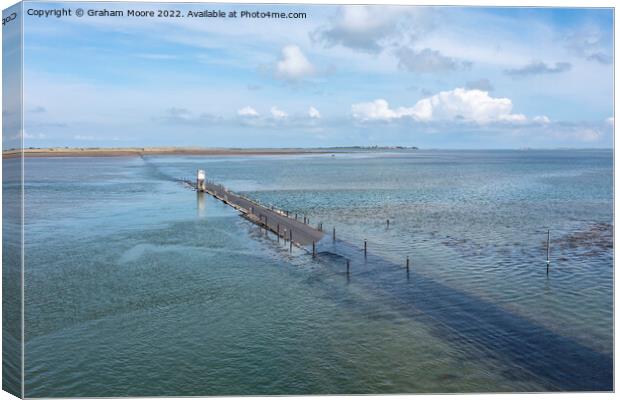 holy island causeway near high tide Canvas Print by Graham Moore