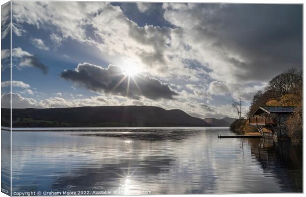 Ullswater boathouse with sun flare Canvas Print by Graham Moore