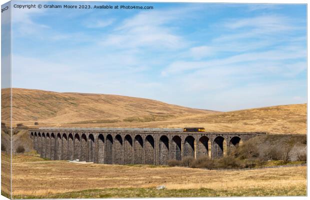 Goods train crossing Ribblehead Viaduct Canvas Print by Graham Moore
