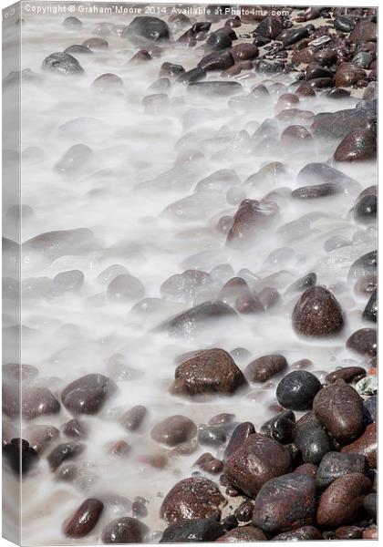 Sea washing over rocks Canvas Print by Graham Moore