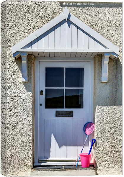 Door with bucket and spade Canvas Print by Graham Moore