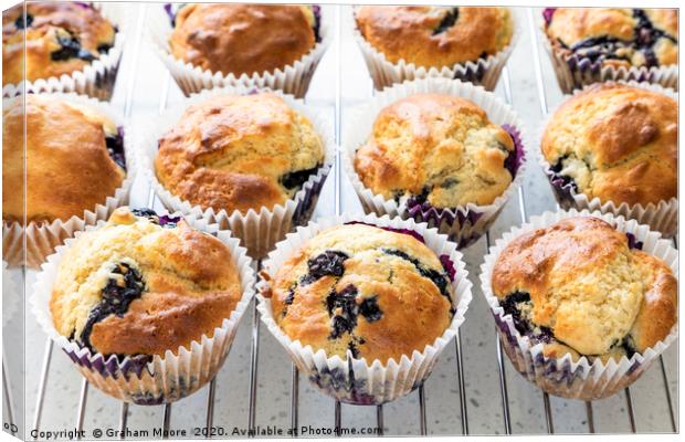 Fresh home baked blueberry muffins Canvas Print by Graham Moore