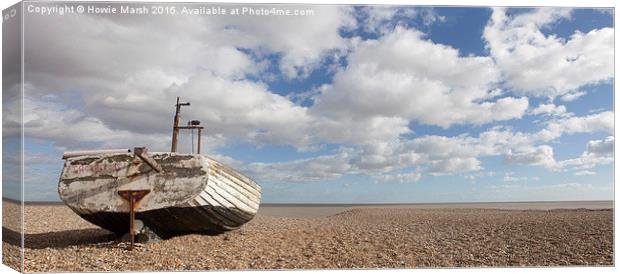  Fishing boat basking on the beach. Canvas Print by Howie Marsh