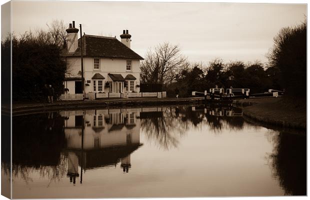 Lock keepers cottage reflected Canvas Print by Martin Patten