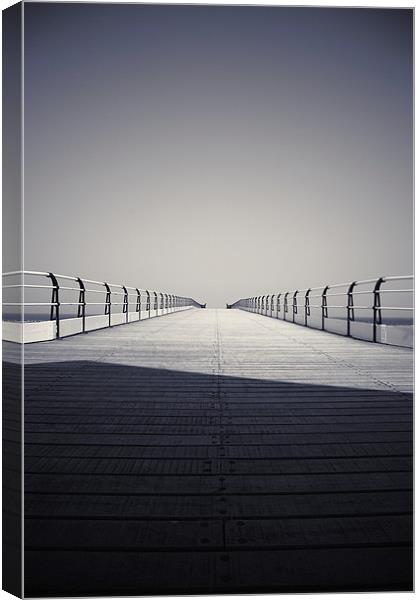 Looking down the pier Canvas Print by Phillip Shannon