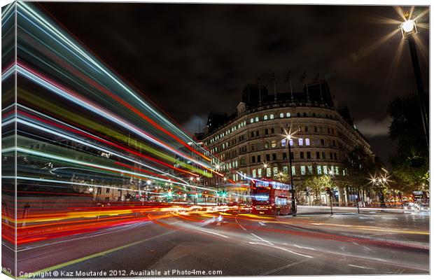 London Bus at Night with Light Trails Canvas Print by Kaz Moutarde