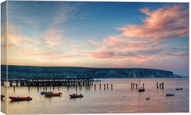 Swanage Pier and Ballard Down at Sunset Canvas Print by Darren Galpin