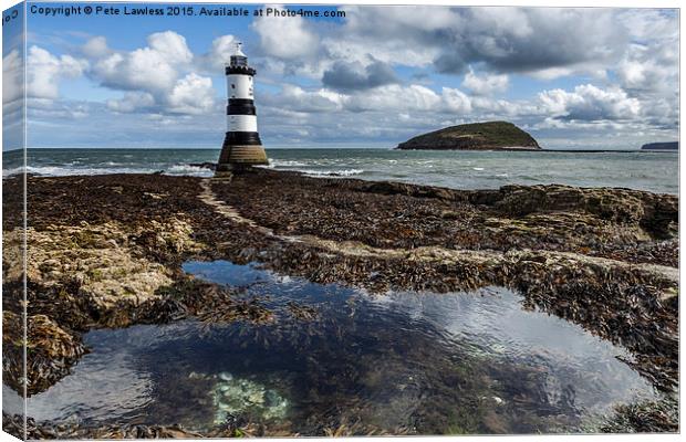  Penmon Lighthouse and rock pool Canvas Print by Pete Lawless