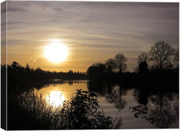 Sunset Over the Riverbank Canvas Print by Jon Mills