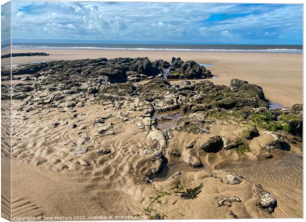 Rocks on the on Beach  Canvas Print by Jane Metters