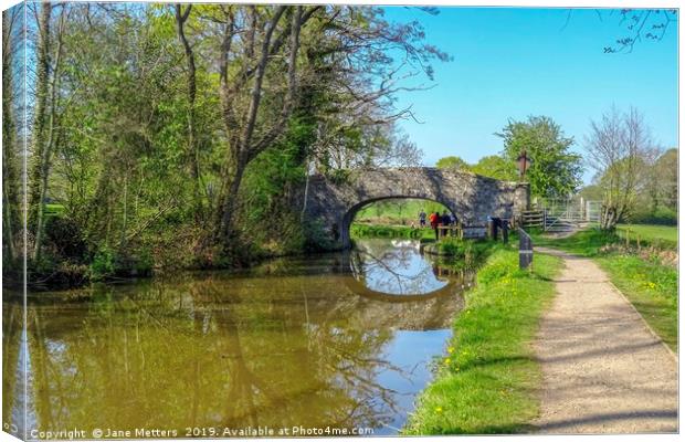 A Walk along the Canal Canvas Print by Jane Metters