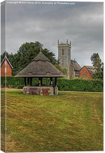 Woodbastwick village green and church Canvas Print by Avril Harris