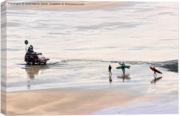 Surfers on woolacombe beach Canvas Print by Avril Harris