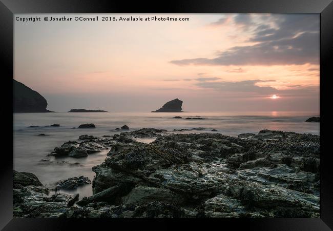 Sunset Over Rocks - Portreath Cornwall UK Framed Print by Jonathan OConnell