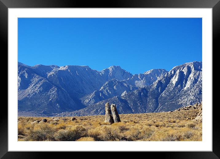 Bizarre rock tower couple and Sierra Nevada, Calif Framed Mounted Print by Claudio Del Luongo
