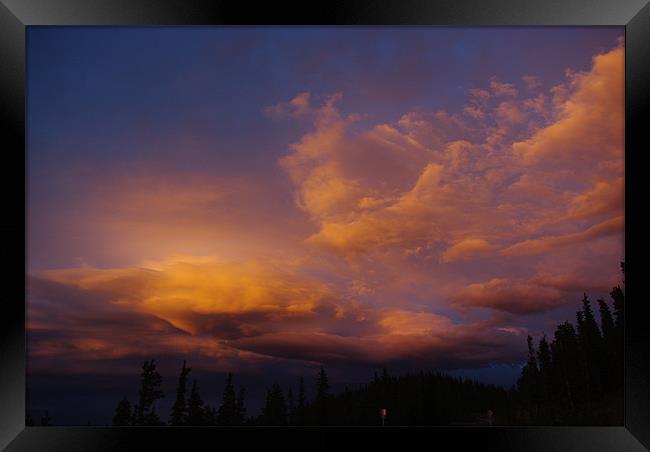 Colourful evening clouds, Rocky Mountains, Colorad Framed Print by Claudio Del Luongo