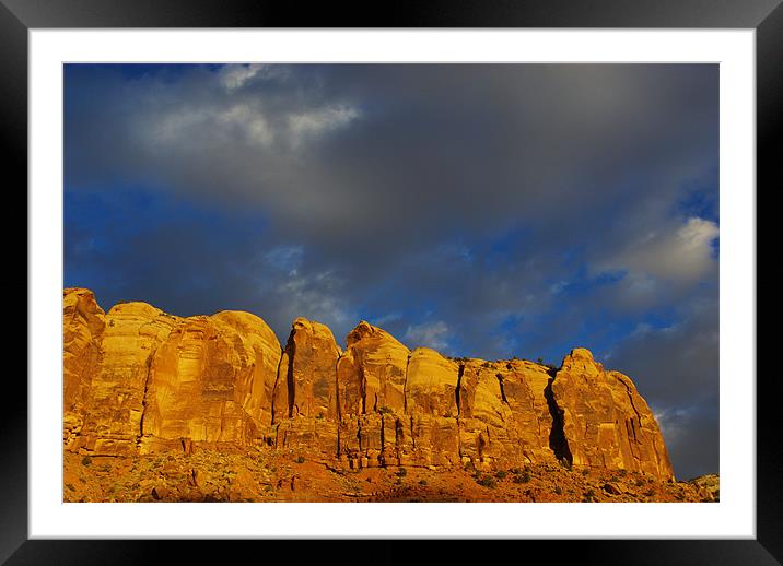 Rock wall in the evening sun Framed Mounted Print by Claudio Del Luongo