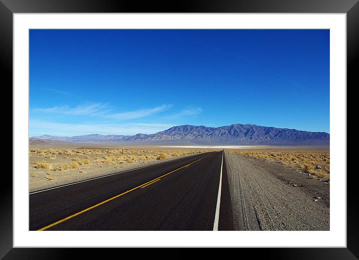 Highway through the desert, Nevada Framed Mounted Print by Claudio Del Luongo