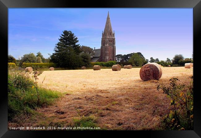 Hay roll and church Framed Print by Graeme B