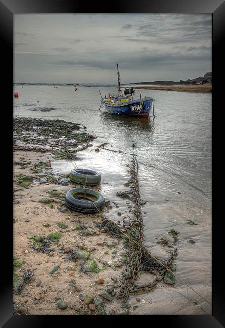 Solitary Boat at Bude in Cornwall Framed Print by Dave Bell