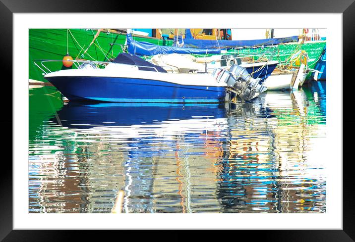 Stunning reflections of blue and green boats in th Framed Mounted Print by Dave Bell