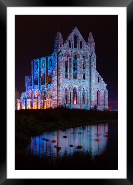 Whitby Abbey Illuminated as for Halloween and Whitby Goth Weeken Framed Mounted Print by Martin Williams