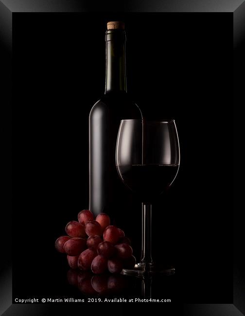 Wine bottle, glass and grapes Framed Print by Martin Williams