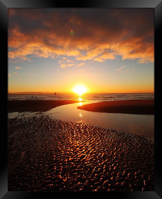 Sand Ripples reflected in a glorious sunset. Framed Print by mike fahy