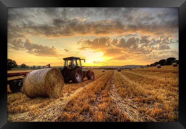 Tractor Harvesting Sunset Framed Print by Simon West