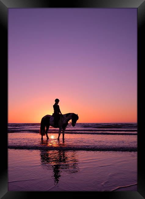 Horse rider at sunset Framed Print by nick woodrow
