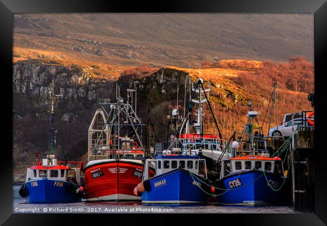 Vessels moored to the Portree pier Framed Print by Richard Smith