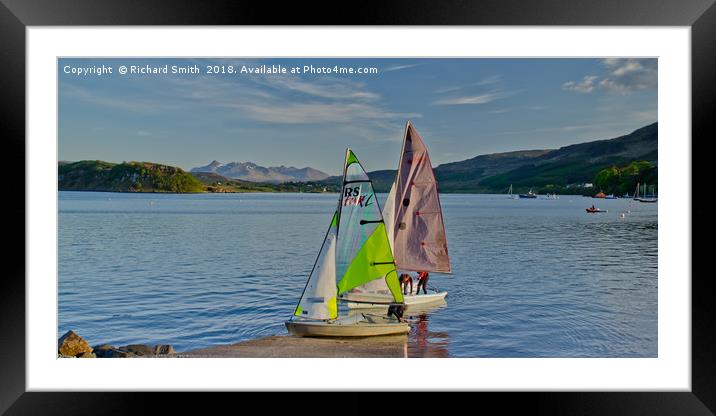 Two sailing dinghies return to the Sailing Club Framed Mounted Print by Richard Smith