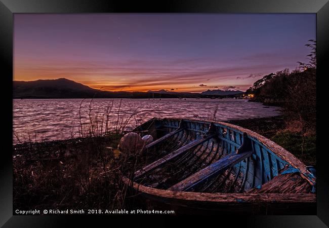 Loch Portree sunrise viewed over a clinker rowboat Framed Print by Richard Smith