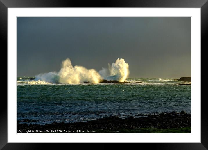 Large wave breaks over rocks close to Staffin Pier. Framed Mounted Print by Richard Smith