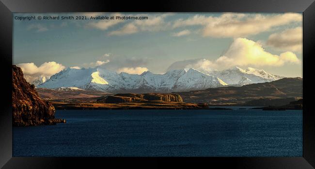 Snow covered Cuillin beyond loch Bracadale. Framed Print by Richard Smith