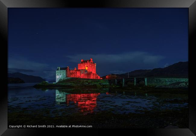 Eilean Donan Castle floodlit for remembrance day. Framed Print by Richard Smith